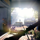 A screenshot from Dying Light 2 depicting protagonist Aiden Caldwell preparing to shoot an arrow at some unsuspecting bandit in a dilapidated warehouse.